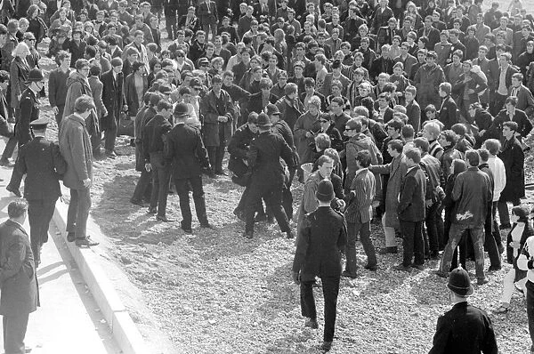 Mods are arrested after clashing with Rockers on Brighton Beach. 19th April 1965