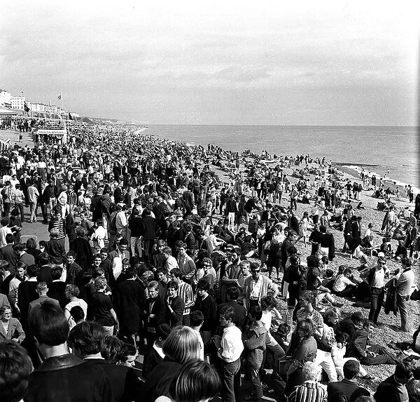Mods and rockers gather on Brighton beach in August 1964