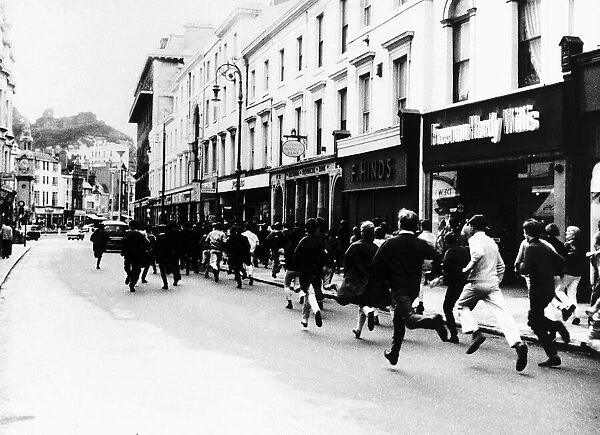 Mods and Rockers running down the streets of Hastings