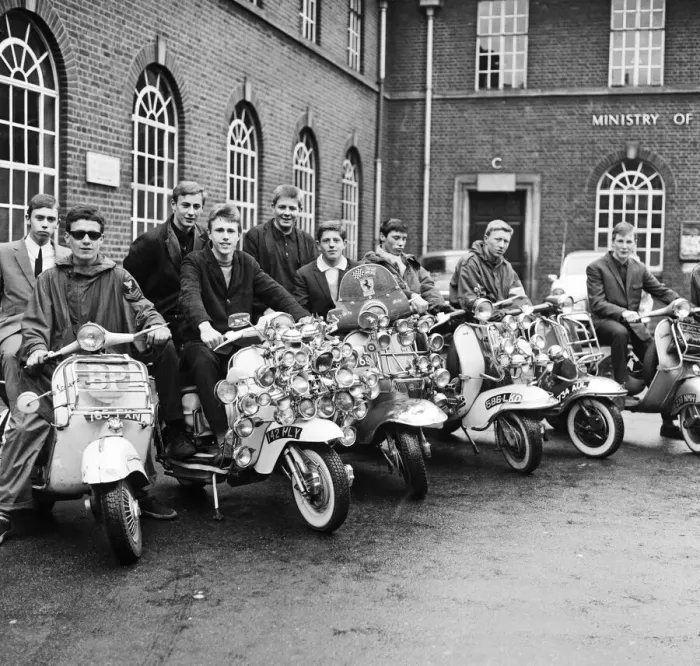 Framed Print : Mods wearing suits and parkas on Motor Scooters covered with extra lights