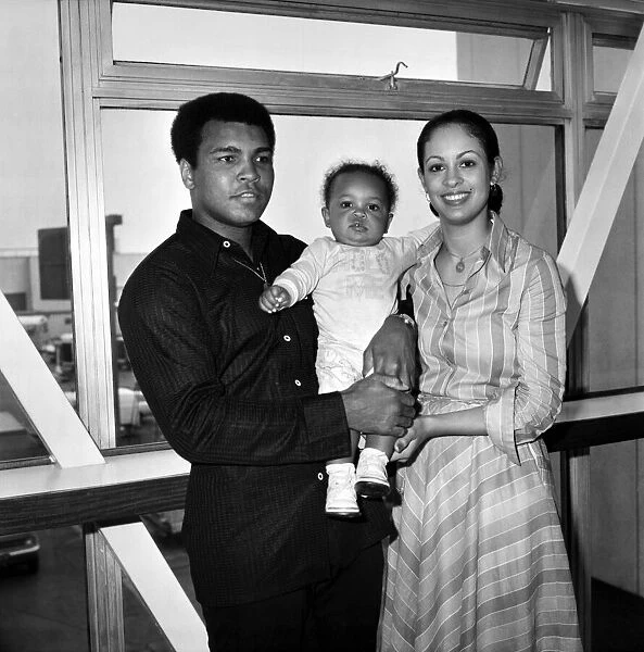 Mohammad Ali pictured with his wife Veronica and baby Hanna at Heathrow Airport today