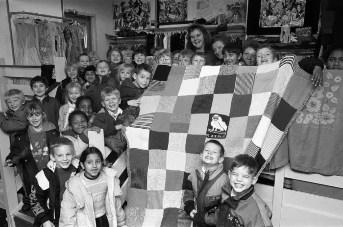 Framed Print : Moldgreen Junior and Infants School pulls with their knitted blanket Framed Print : Moldgreen Junior and Infants School pulls with their knitted blanket