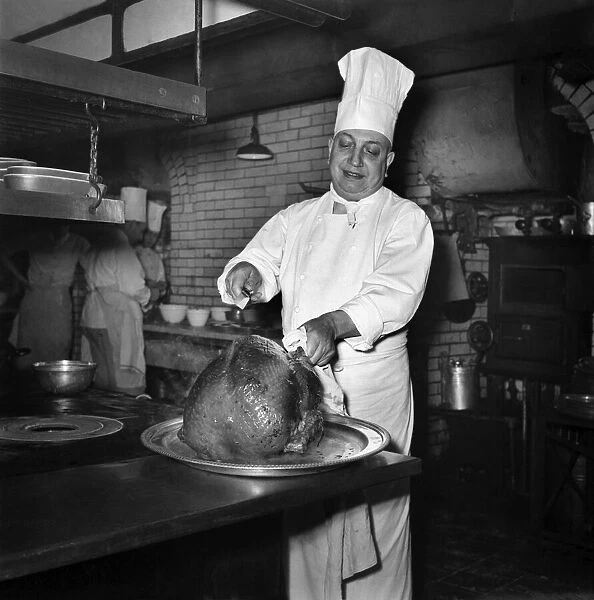 Monsieur Alban, lead chef at Savoy Hotel, with turkey. December 1949 O21983-004