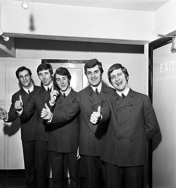 The Moody Blues, give a thumbs up after learning that they are Top of the Pops