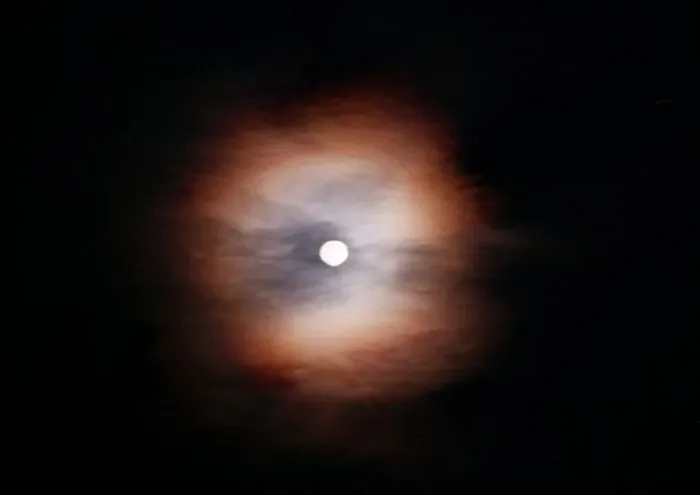  : The Moon behind clouds in Italy August 1997
