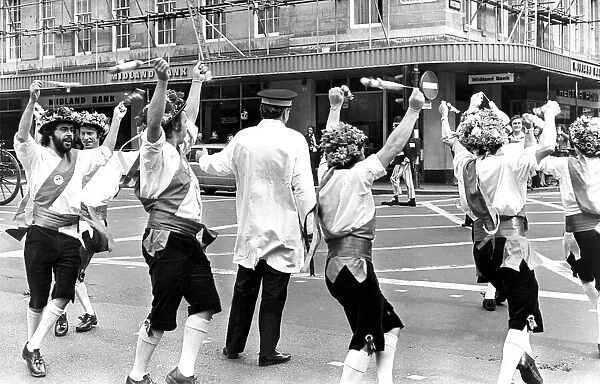 Morris dancers enterraining a traffic warden in Newcastle in 1976
