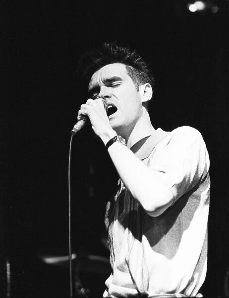 Morrissey, lead singer of Manchester group The Smiths, performing in concert