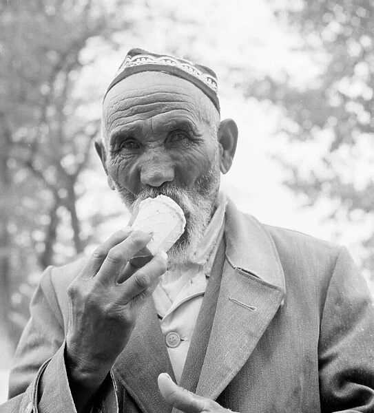 A Moscow resident enjoys an ice cream April 1960