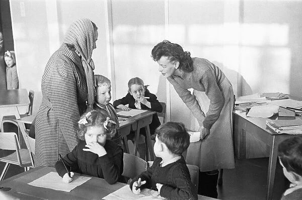 A mother drops off her son at his new school, South Mead School, Southfield, Wimbledon