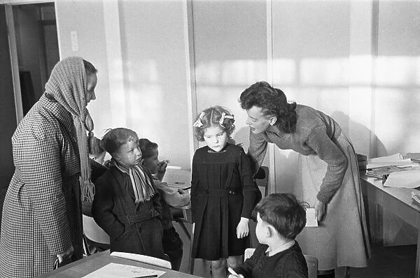 A mother drops off her son at his new school, South Mead School, Southfield, Wimbledon