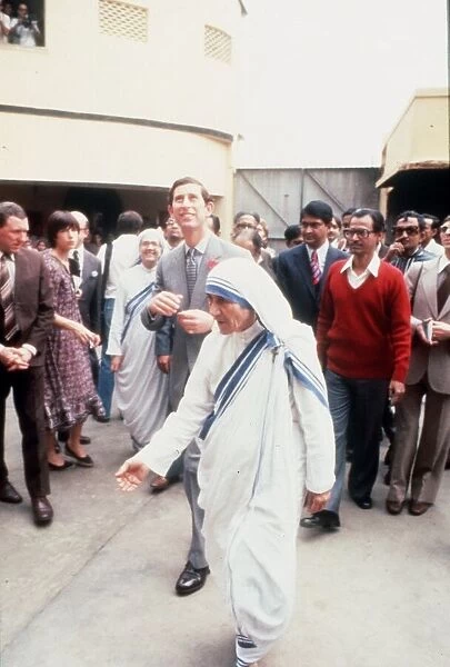 Mother Theresa walking in the street in India with Prince Charles
