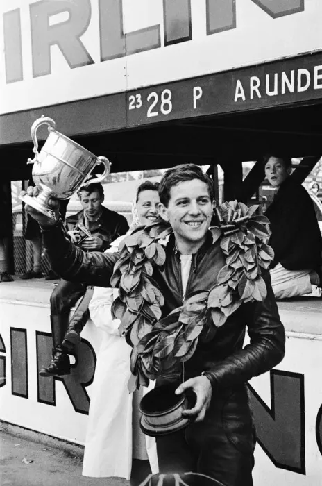 Framed Print : Motor Cycle Racing at Oulton Park. Phil Read celebrates with the trophy after Framed Print : Motor Cycle Racing at Oulton Park. Phil Read celebrates with the trophy after