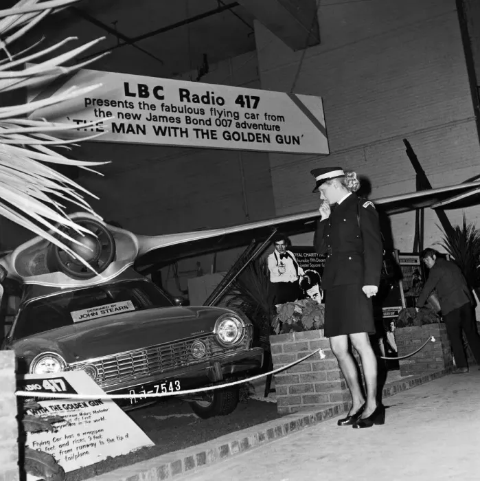 Framed Print : Motor Show Preview Day at Earls Court. Traffic Warden Jacqui Smith looks Framed Print : Motor Show Preview Day at Earls Court. Traffic Warden Jacqui Smith looks
