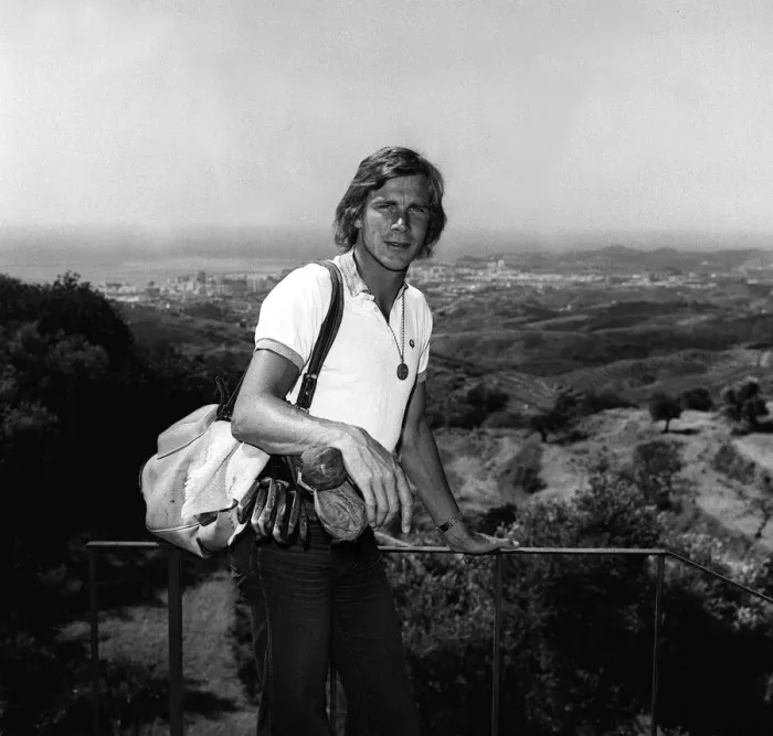 Framed Print : Motor racing driver James hunt on holiday in Spain 1975 with his golf clubs