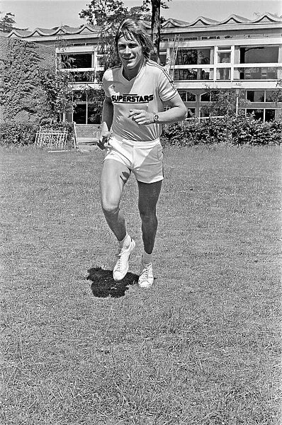 Motor Racing Driver James Hunt jogging and smiling to the camera