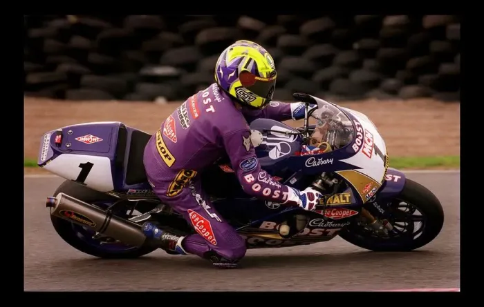 Framed Print : Motorcycle Racing August 1998 cyclist in purple Boost sponsored suit