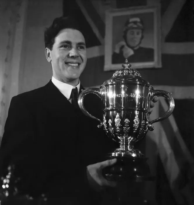 Framed Print : Motorcycle racing champion Geoff Duke with the World Championship trophy