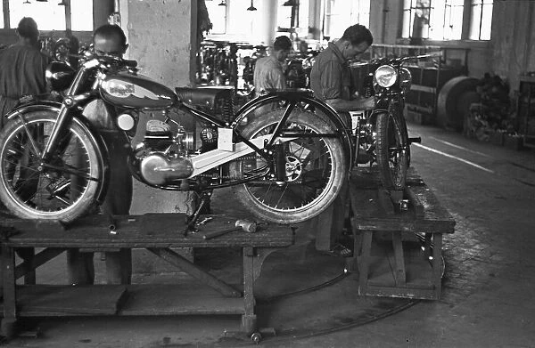 Motorcycles being assembled on the production line at the Bianchi factory in Milan