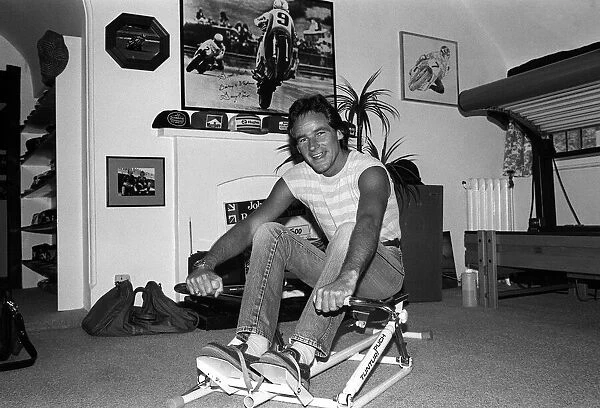 Motorcyclist Barry Sheene at home working out 1984 on rowing machine