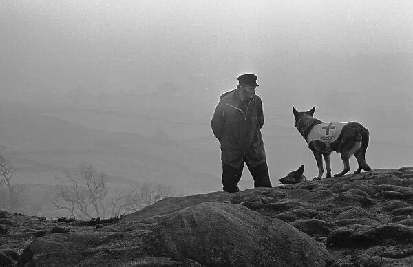 Mountain Rescue Dog Team seen here high on the Cumbrian hills. Circa 1975