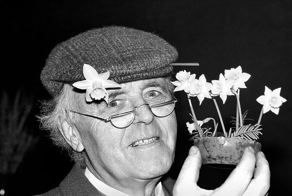 Mr. Allan Warner. Man with flowers. January 1975 75-00531-002