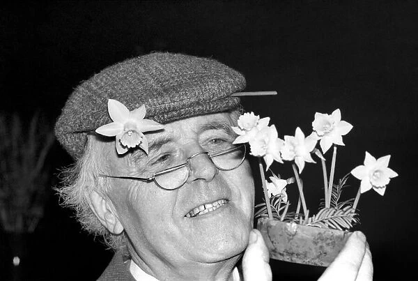 Mr. Allan Warner. Man with flowers. January 1975 75-00531