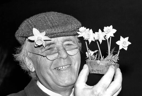 Mr. Allan Warner. Man with flowers. January 1975 75-00531-001