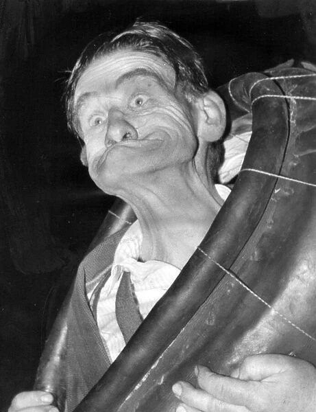 Mr Bennison demonstrates the winning twist - gurning. 18th September 1965
