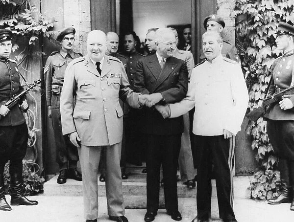 Mr Churchill, President Truman and Generalissimo Stalin linking hands outside the Prime