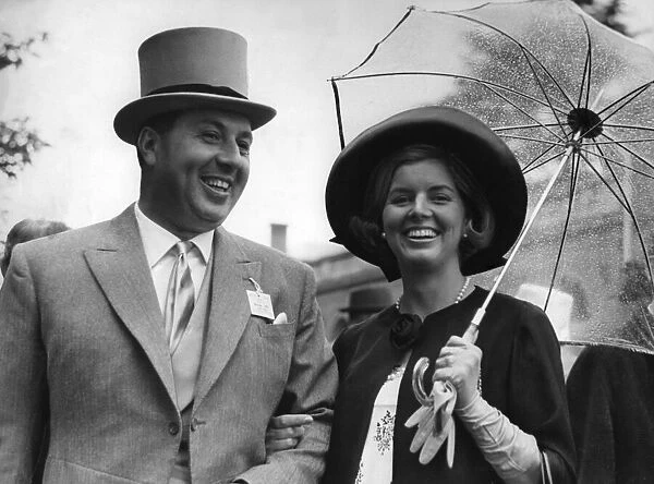 Mr. Doug Ellis, the Birmingham travel agent, and his wife at Ascot yesterday. Mrs
