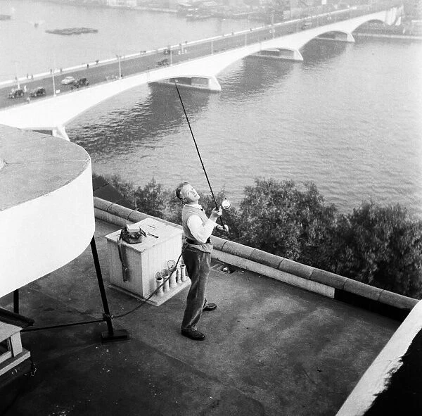 Mr. E. Drury, for a wager, cast a line from the roof of The Savoy Hotel to the river