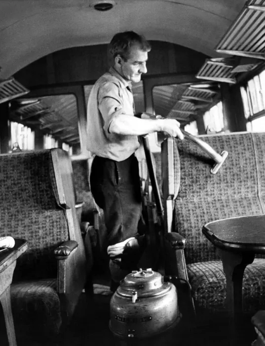 Framed Print : Mr. Frank Baley vacuums seats while cleaning a carriage ready for another journey on 10th Framed Print : Mr. Frank Baley vacuums seats while cleaning a carriage ready for another journey on 10th
