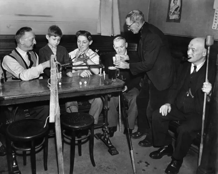 Framed Print : Mr. Herbert Robinson and his 17 year old son Colin, explaining the working of Framed Print : Mr. Herbert Robinson and his 17 year old son Colin, explaining the working of