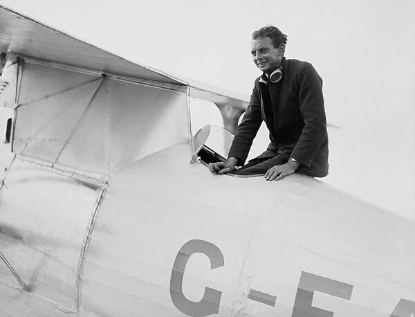 Mr Jimmy James, winner of the Aerial Derby at Hendon sitting in his plane