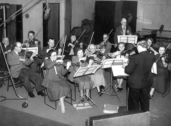 Mr. Johnson H Hood conducting the Newcastle City Orchestra in a rehearsal of Mozarts