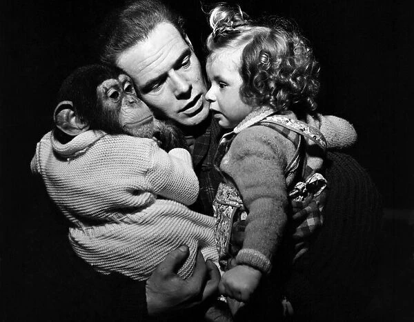 Mr Kerr & daughter Alexis with chimps. April 1952 C1740-003
