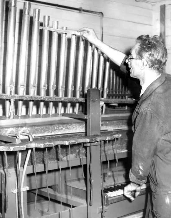 Framed Print : Mr. Leslie Rowland, aged 53, tunes the pipes of this organ on a voicing machine in Framed Print : Mr. Leslie Rowland, aged 53, tunes the pipes of this organ on a voicing machine in