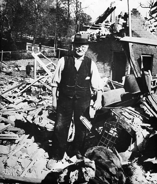 Mr McGregor stands amidst the debris of his house, following a Baedeker Raid on York