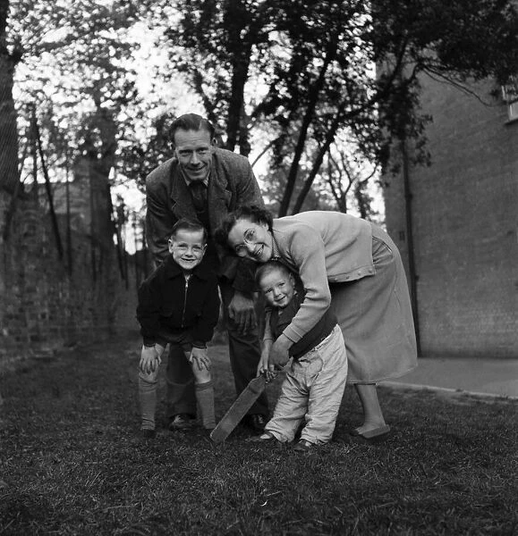 Mr and Mrs. B. Nicholls of Balham with their two children, Roger, 5, and Garry, two