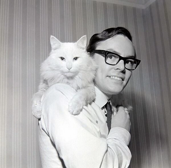 Mr P. O Gara and his cat sat on his shoulders December 1965