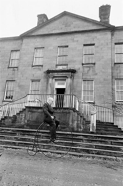 Mr Philip Yorke takes a trip around the grounds of his house on a Penny Farthing