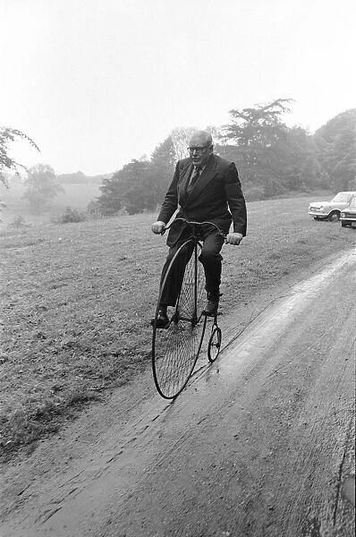 Mr Philip Yorke takes a trip around the grounds of his house on a Penny Farthing