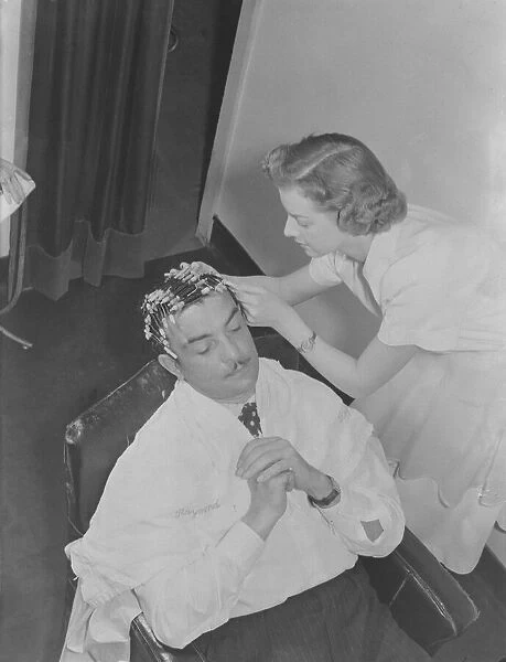 Mr Raymond, hair stylist has 'new poodle cut'7  /  3  /  1951 Cole Staff