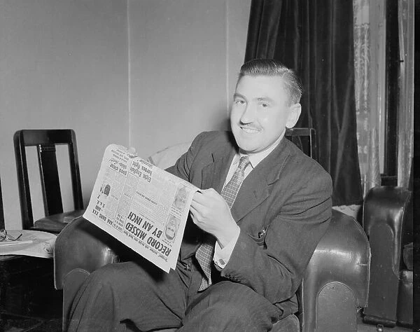 Mr Robert Hope seen here at home reading the Daily Mirror