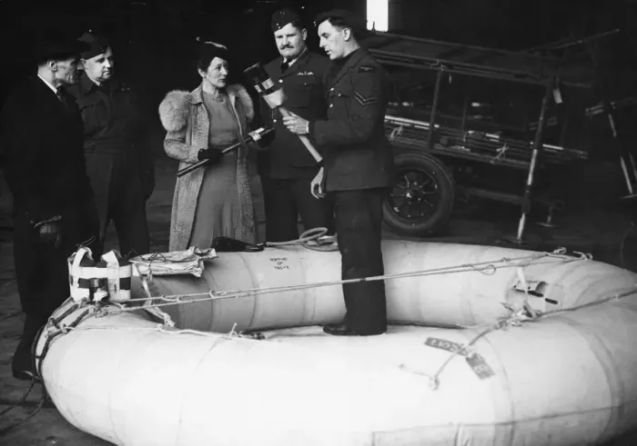 Framed Print : Mr S. R. Johnson (left) and Miss V. S. Bowers inspecting the rubber dinghy which their firm Framed Print : Mr S. R. Johnson (left) and Miss V. S. Bowers inspecting the rubber dinghy which their firm