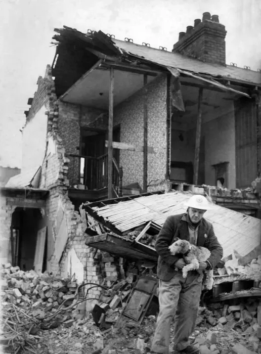 Framed Print : Mr. Sydney Colman tends to an injured wire haired terrier after air raid on north east Framed Print : Mr. Sydney Colman tends to an injured wire haired terrier after air raid on north east