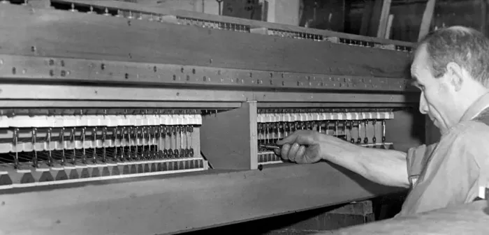 Framed Print : Mr. T. H. Pollard working on the sound board of the Felling organ in December 1946 Framed Print : Mr. T. H. Pollard working on the sound board of the Felling organ in December 1946