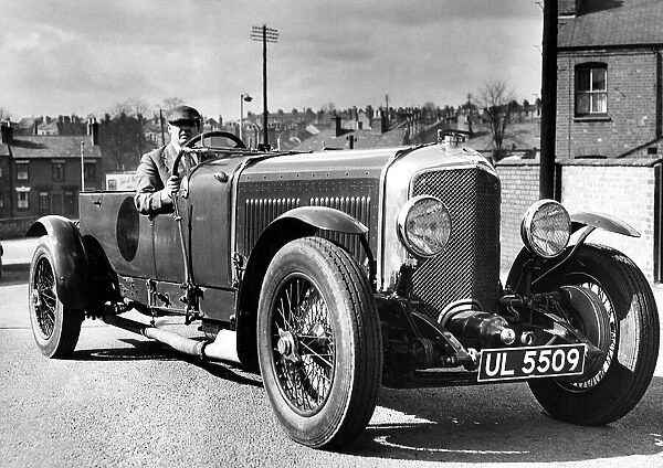 Mr. Tom Whale at the wheel of a Bentley Speed Six which he paid £