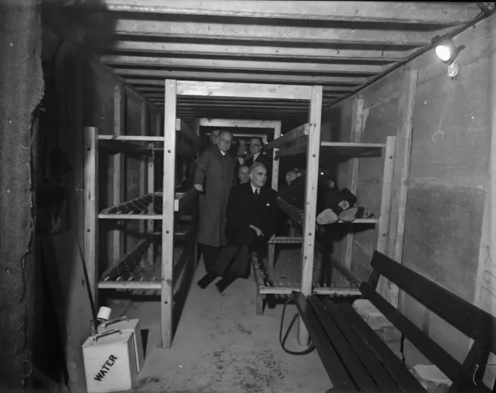 Framed Print : Mr. Walter Higgs. M. P. tries out one of the new bunks in a public air raid shelter while