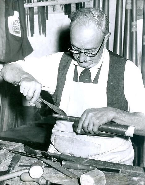 Mr. William Lovejoy, aged 69, assembles double trumpet reeds for an organ in